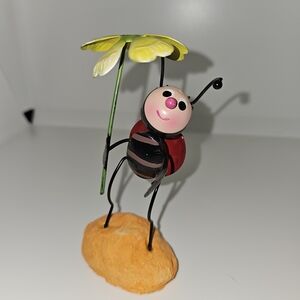Small Ladybug Art Sculpture with Yellow Flower